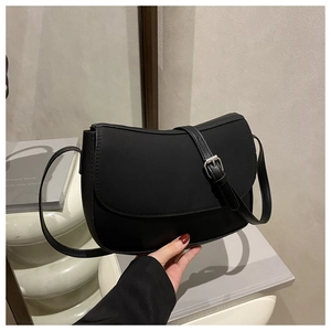 Detail view of black PU leather underarm bag with silver metal adjustable buckle strap