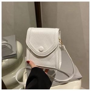 Detail of white mini crossbody phone bag featuring diamond lattice stitching and metal buckle