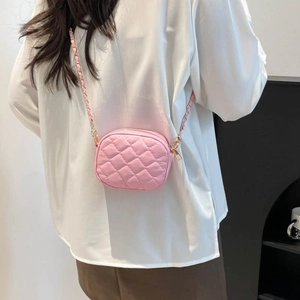 Pink quilted stitching camera bag with chain strap and shiny synthetic leather finish