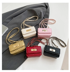 Detailed view of mini chevron quilted chain bags in ivory, pink, gold, red, and black