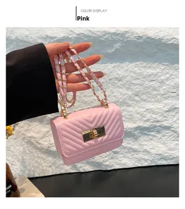 Detailed view of pink quilted PU leather crossbody bag with golden chain and clasp