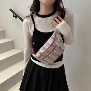 Pink and purple striped large nylon chest bag for women styled as a casual crossbody bag
