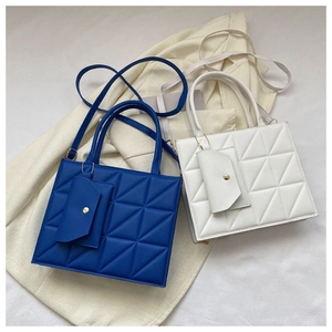 Quilted geometric texture detail on royal blue and ivory white crossbody flap bags
