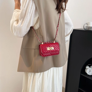 Chic red mini square crossbody bag with classic V-quilt pattern and gold chain strap