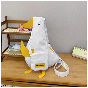 Detail of cute white duck canvas crossbody bag featuring 3D feet and fashion label