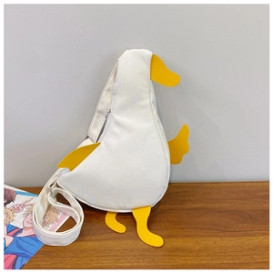 Detail of creative white canvas duck chest bag with yellow beak and adjustable strap