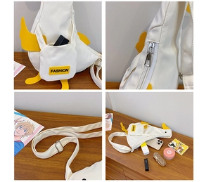 Detail view of duck canvas bag showing fashion label, zipper and adjustable strap
