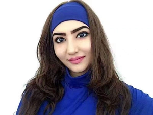 Detail view of dark blue elastic cotton yoga headband and matching turtleneck collar
