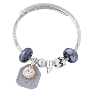 Chic silver snake chain charm bracelet with purple glass beads and shoe pendant