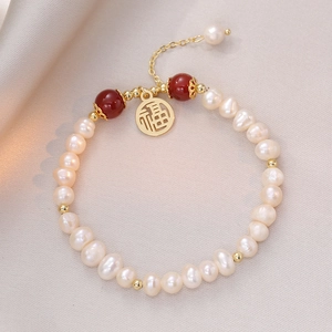 Elegant baroque pearl bracelet with red agate beads and golden Fu character charm
