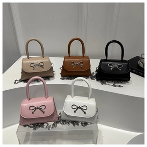 Collection of mini crossbody bags with silver bow buckles in five different colors
