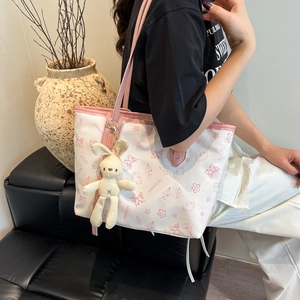 White butterfly print tote bag with pink trim and cute bunny plush charm for women