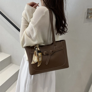 Large brown tote bag with silk scarf and shoulder strap for spring 2025 casual fashion