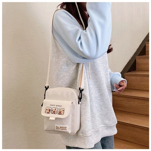 Cute beige canvas crossbody bag for women featuring Capybara cartoon patterns and a flap closure