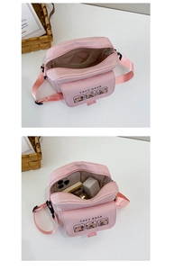 Pink Capybara canvas crossbody bag showing inner storage for phone and accessories