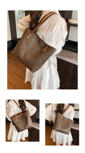 Detailed view of a vintage brown tote bag with circular logo patterns and metallic rivets