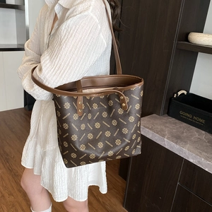 Vintage dark brown leather tote bag with floral pattern for women's daily commute