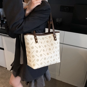 Retro cream monogram tote bag with brown leather handles for women's daily commute