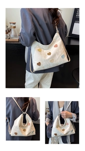 Detailed views of white pleated tote bag with colorful heart patches and slim straps
