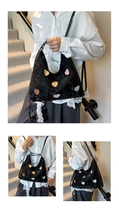 Close-up of black wrinkled texture tote bag featuring colorful heart-shaped patches