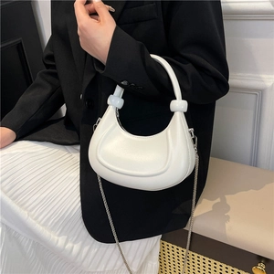 Modern white crescent underarm bag with silver chain strap and minimalist beaded handle
