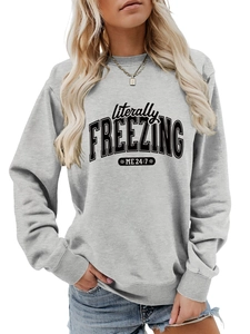 Close-up of ribbed cuffs and literally FREEZING ME 24:7 print on gray sweatshirt