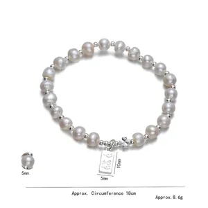 Elegant S925 silver pearl bracelet with heart charm and clover pendant on white background