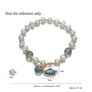 Baroque pearl bracelet with green beads and gold ginkgo leaf pendant, 17cm length