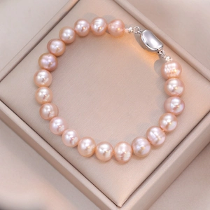 Elegantes S925 Sterlingsilber Süßwasserperlenarmband mit natürlichen rosa-orangen Perlen