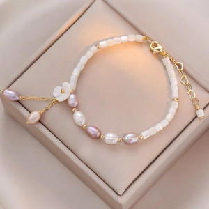 Elegant natural freshwater pearl bracelet with shell flower charm and gold lobster clasp