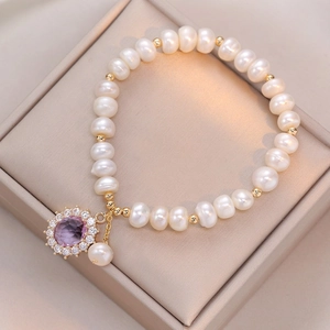 Elegant freshwater pearl bracelet with purple zircon pendant and golden metal beads