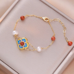 Vintage gold flower bracelet with freshwater pearls and blue cloisonne enamel details