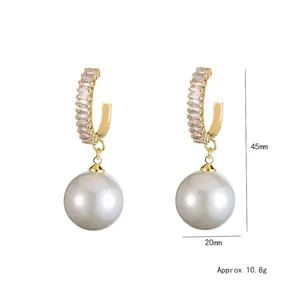 Elegant silver earrings with sparkling zircon crystals and large round white pearls