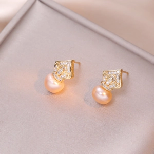Elegant crown design earrings with pink drop pearls and cubic zirconia on gray tray