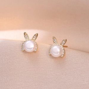 Elegant gold rabbit earrings with natural freshwater pearls and sparkling zircons