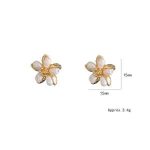 Floral freshwater pearl earrings with gold frames showing size 15mm and weight 3.4g