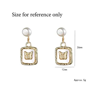 Retro butterfly relief earrings with natural freshwater pearls and golden frame, 26mm height