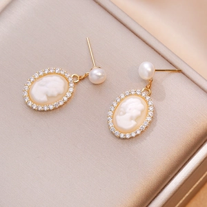 Vintage cameo drop earrings with freshwater pearls and sparkling zirconia accents