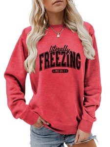 Detail of red crewneck sweatshirt featuring literally FREEZING text print design
