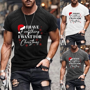 Detail view of cotton Christmas t-shirts in black, white and grey with festive typography
