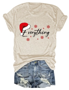 Detail of Christmas themed T-shirt with Everything print and red Santa hat decoration