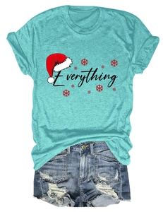 Detail of Christmas Everything print on blue t-shirt with ripped denim shorts set