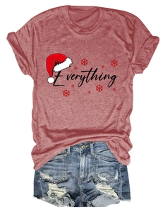 Close-up of red Christmas T-shirt with Everything text paired with ripped denim shorts