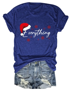 Flat lay of blue Christmas T-shirt with Everything print and distressed denim shorts