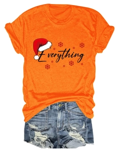 Detail of the bright orange T-shirt with Everything print and distressed denim shorts