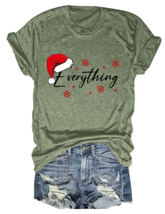 Detail of green T-shirt with 'Everything' holiday print and distressed denim shorts