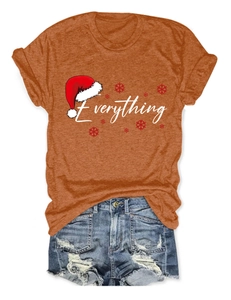 Detail view of orange cotton t-shirt with Everything print and distressed denim shorts