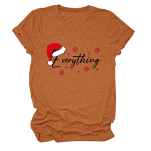 Detailed view of rust-red Christmas t-shirt fabric with Everything text and snowflakes