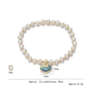 Lustrous freshwater pearl bracelet with golden shell lock pendant on white background
