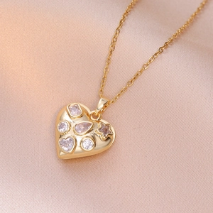 Elegant gold heart pendant necklace with various zircon stones on champagne silk